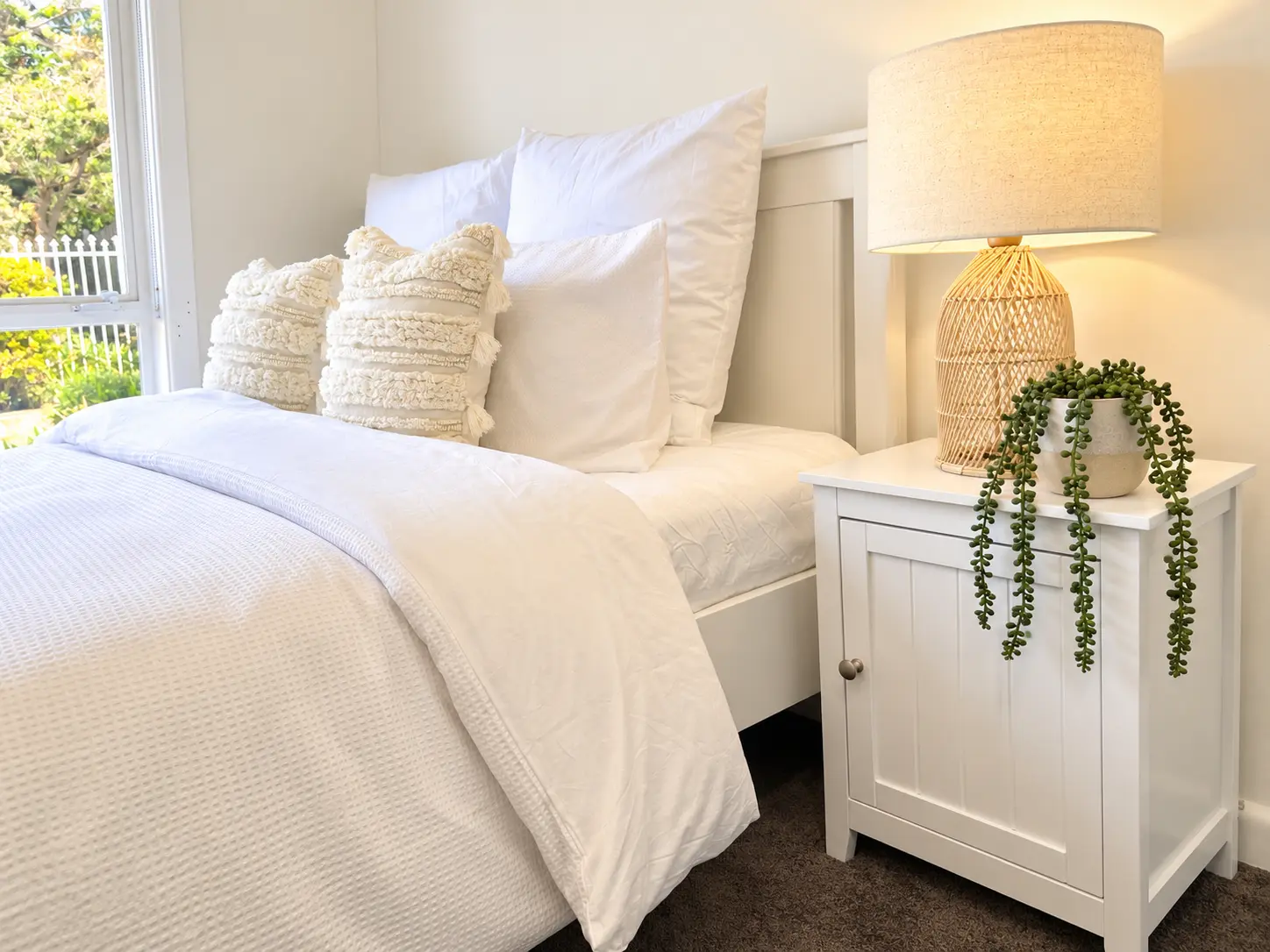 Hampton East Room 1 — bedside and bedding